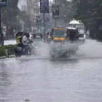 Waterlogged Mumbai road with stranded vehicles due to heavy monsoon rain in Maharashtra