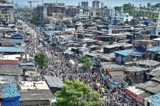 Residents engaging in Dharavi Redevelopment Project survey activities near Kumbharwada